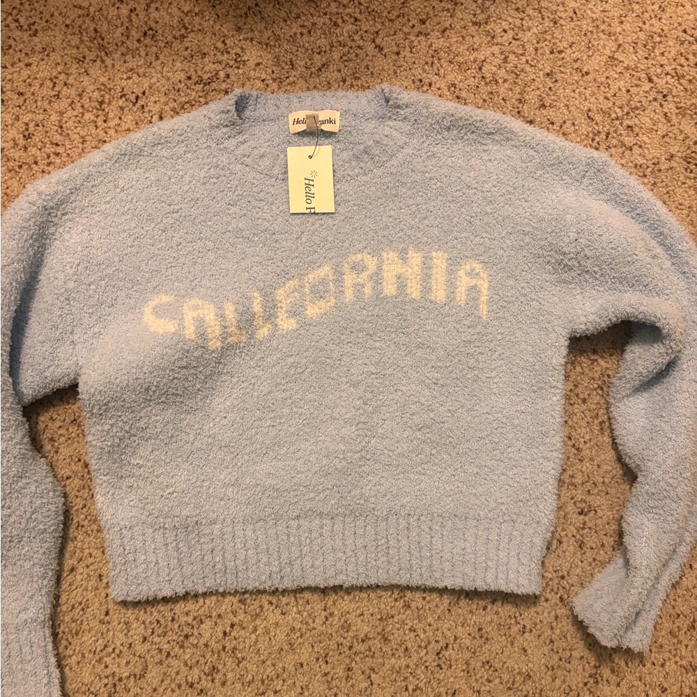 Blue girl’s sweater